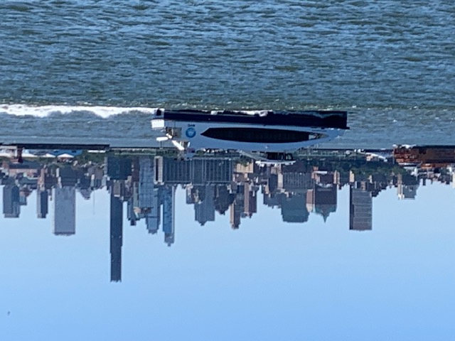 NYC ferry with Manhattan skyline